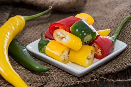 Mixed Chillis on wooden backgroundの写真素材