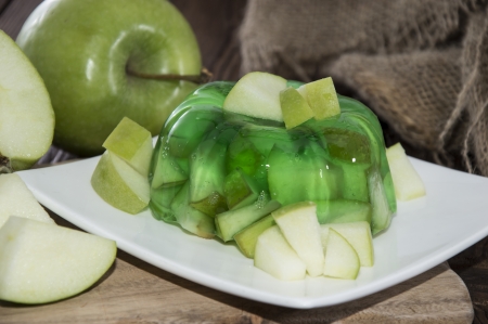 Portion of Apple Jelly with fresh fruits on wooden backgroundの写真素材