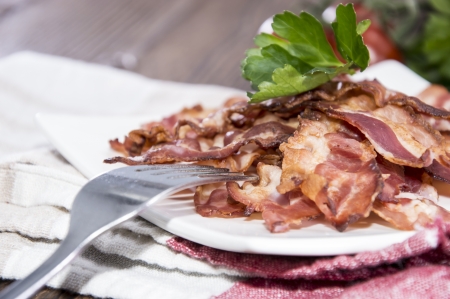 Portion of Fried Bacon on wooden backgroundの写真素材