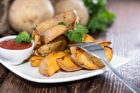 Portion of fresh homemade Potato Wedgesの写真素材