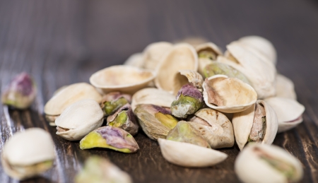 Pistachio Shells on vintage wooden background