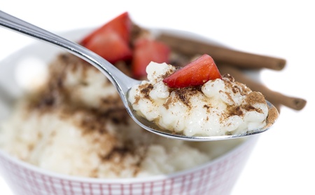 Cinnamon Rice Pudding on a spoon isolated on white backgroundの写真素材