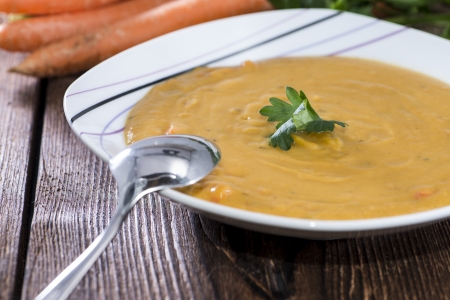 Homemade Carrot Soup topped with parsleyの写真素材