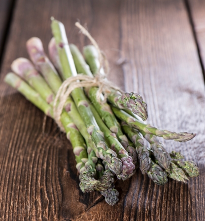 Bunch of Green Asparagus on wooden backgroundの写真素材