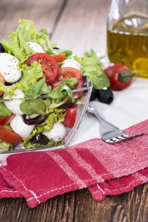 Fresh Portion of Salad with pieces of Mozzarella and Olivesの写真素材