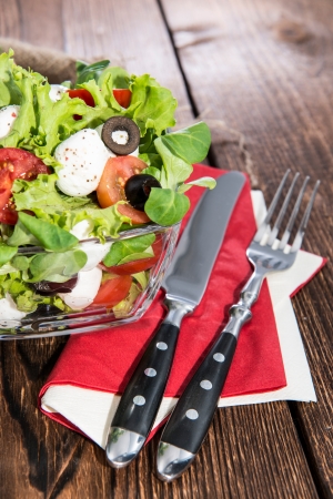 Fresh Portion of Salad with pieces of Mozzarella and Olivesの写真素材