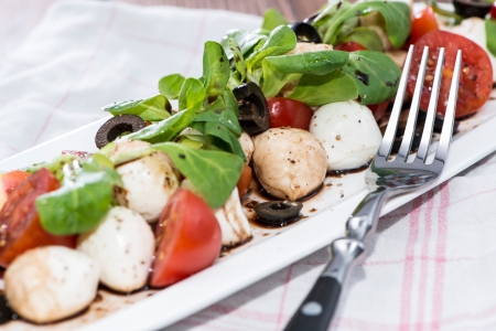 Portion of Salad with Balsamic Vinegar on a plateの写真素材