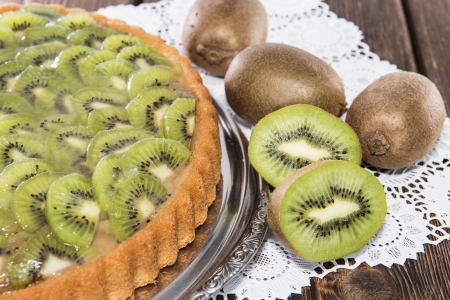 Kiwi Tart on vintage wooden backgroundの写真素材