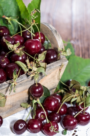Fresh Cherries on vintage wooden backgroundの写真素材