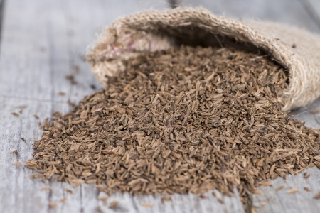 Sack with Caraway (macro shot on vintage wooden background)の写真素材