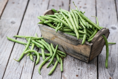 Green Beans on vintage wooden backgroundの写真素材