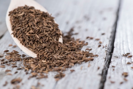 Caraway on a wooden spoon (macro shot)の写真素材