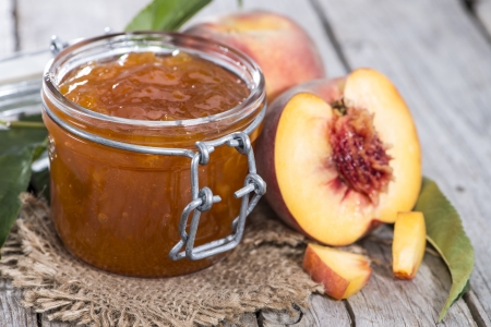 Homemade Peach Jam on wooden backgroundの写真素材