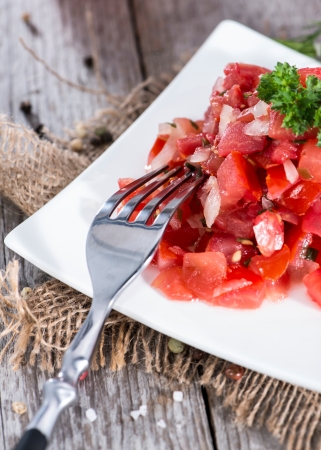 Homemade Tomato Salad on vintage wooden backgroundの写真素材