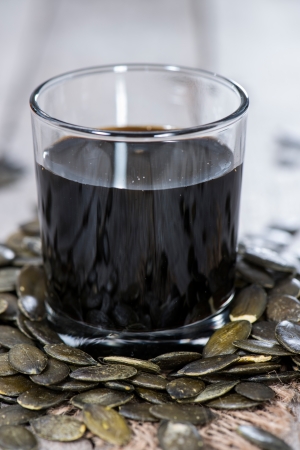 Fresh Pumpkin Seed Oil on vintage backgroundの写真素材