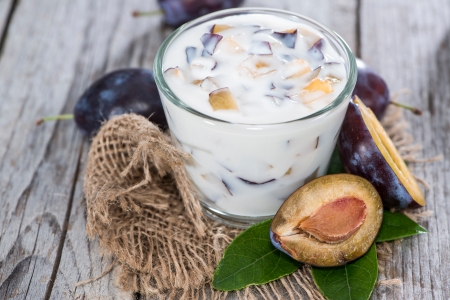 Portion of Plum Yoghurt with fresh fruitsの写真素材