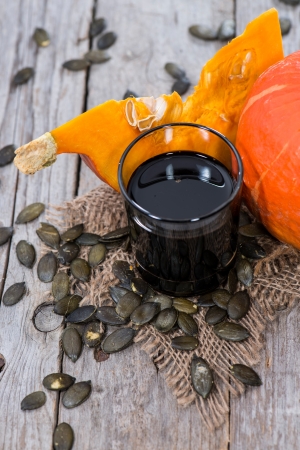 Fresh Pumpkin Seed Oil on vintage backgroundの写真素材
