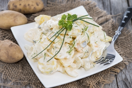 Heap of Potato Salad with some fresh herbsの写真素材