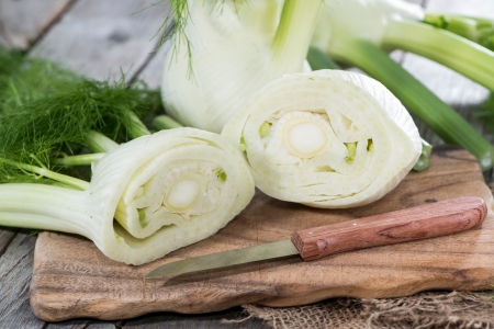 Some pieces of fresh Fennel on woodの写真素材