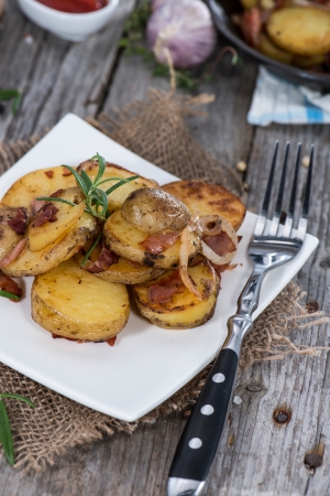 Heap of Roasted Potatoes on vintage wooden backgroundの写真素材