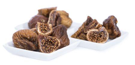 Portion of fresh dried Figs isolated on white backgroundの写真素材