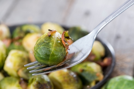 Portion of fried Brussel Sprouts with Ham and Onionsの写真素材