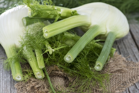 Some pieces of fresh Fennel on woodの写真素材