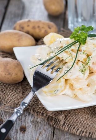 Portion of homemade Potato Salad with fresh herbsの写真素材