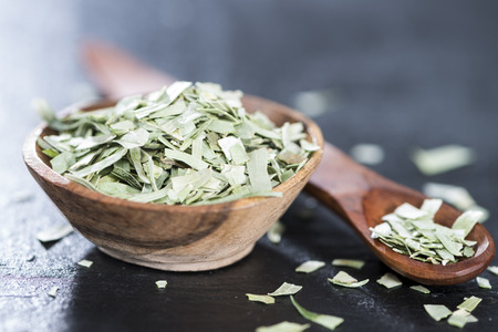 Portion of dried Tarragon in a small bowlの写真素材