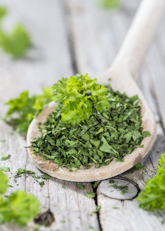Wooden Spoon with dried Parsley (close-up shot)の写真素材