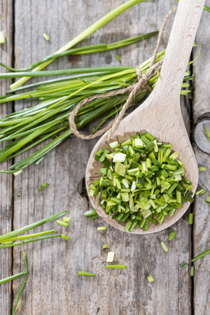 Wooden Spoon with fresh Chive (close-up shot)の写真素材
