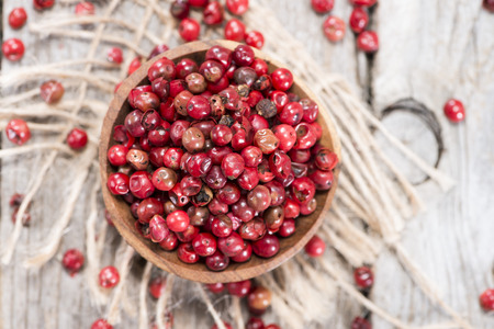 Portion of dried Pink Peppercorns (detailed close-up shot)の写真素材