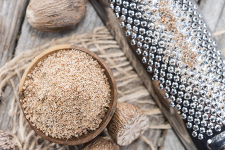 Portion of fresh grated Nutmegs (close-up shot)の写真素材