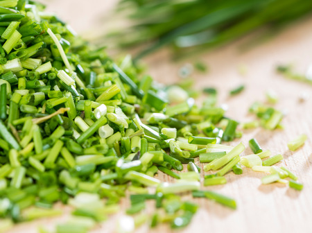 Small portion of fresh cutted Chive on vintage backgroundの写真素材