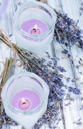 Lavender Candles in small glasses with some dried plantsの写真素材