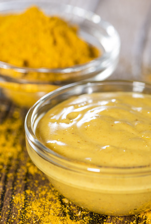 Homemade Curry Sauce in a small bowl in vintage backgroundの写真素材