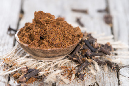 Clove Powder in a small bowl (close-up shot)の写真素材