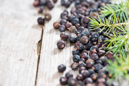 Heap of Juniper Berries (close-up shot) on vintage wooden backgroundの写真素材