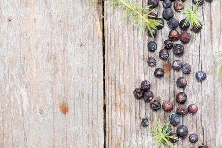 Heap of Juniper Berries (close-up shot) on vintage wooden backgroundの写真素材