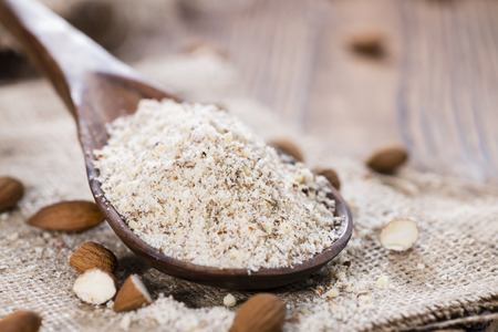 Fresh grated Almonds (detailed close-up shot) on wooden backgroundの写真素材