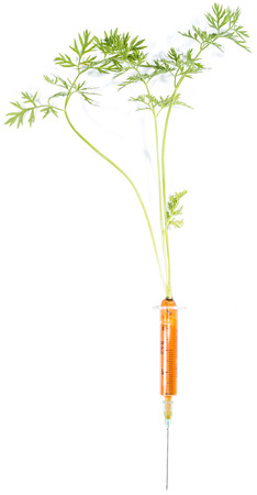 Carrot Injection (with green) isolated on white backgroundの写真素材