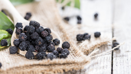 Heap of dried Chokeberries (detailed close-up shot)の写真素材