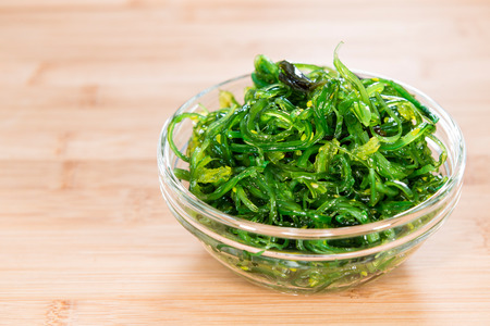 Kelp Salad (detailed close-up shot) on wooden background