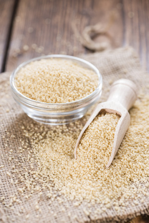 Portion of Couscous (close-up shot) on wooden backgroundの写真素材