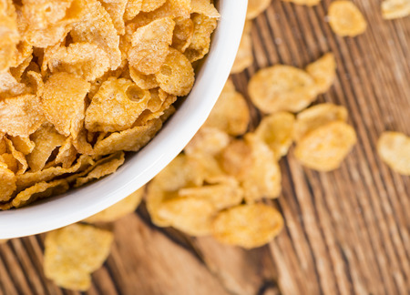 Old wooden table with a portion of Cornflakes