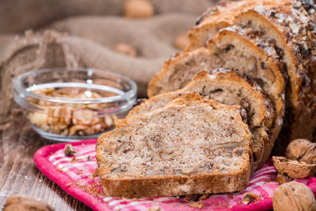 Walnut Bread (fresh baked) on dark vintage wooden background