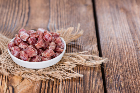 Sliced Mini-Salamis (detailed close-up shot) in a small bowlの写真素材
