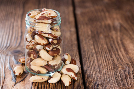 Brazil Nuts (detailed close-up shot) on an old vintage background