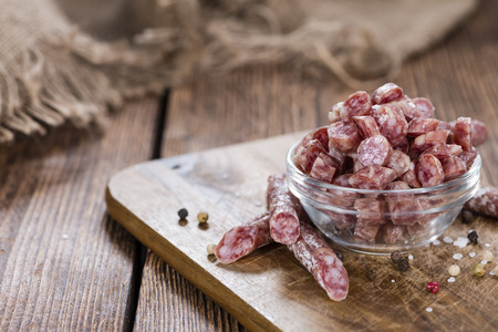 Mini Salamis (detailed close-up shot) on rustic wooden backgroundの写真素材