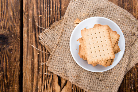 Stacked Butter Biscuits (close-up shot) on wooden backgroundの写真素材
